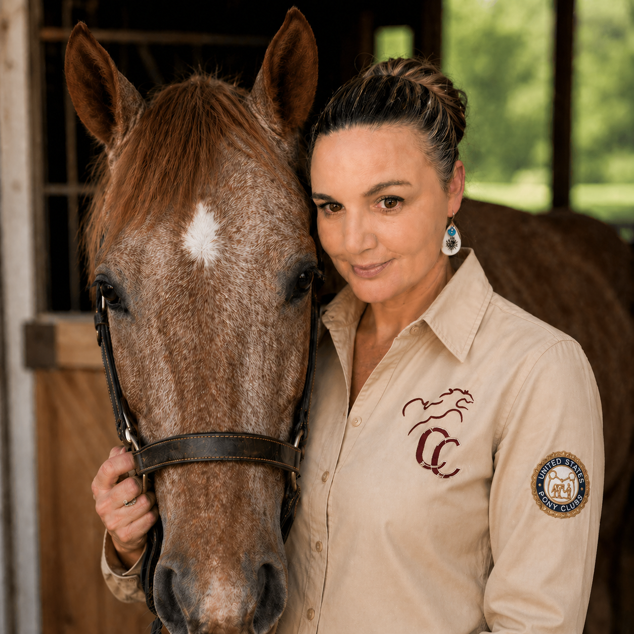 Christine with her horse, wearing a Double C Ranch shirt with the Pony Club patch